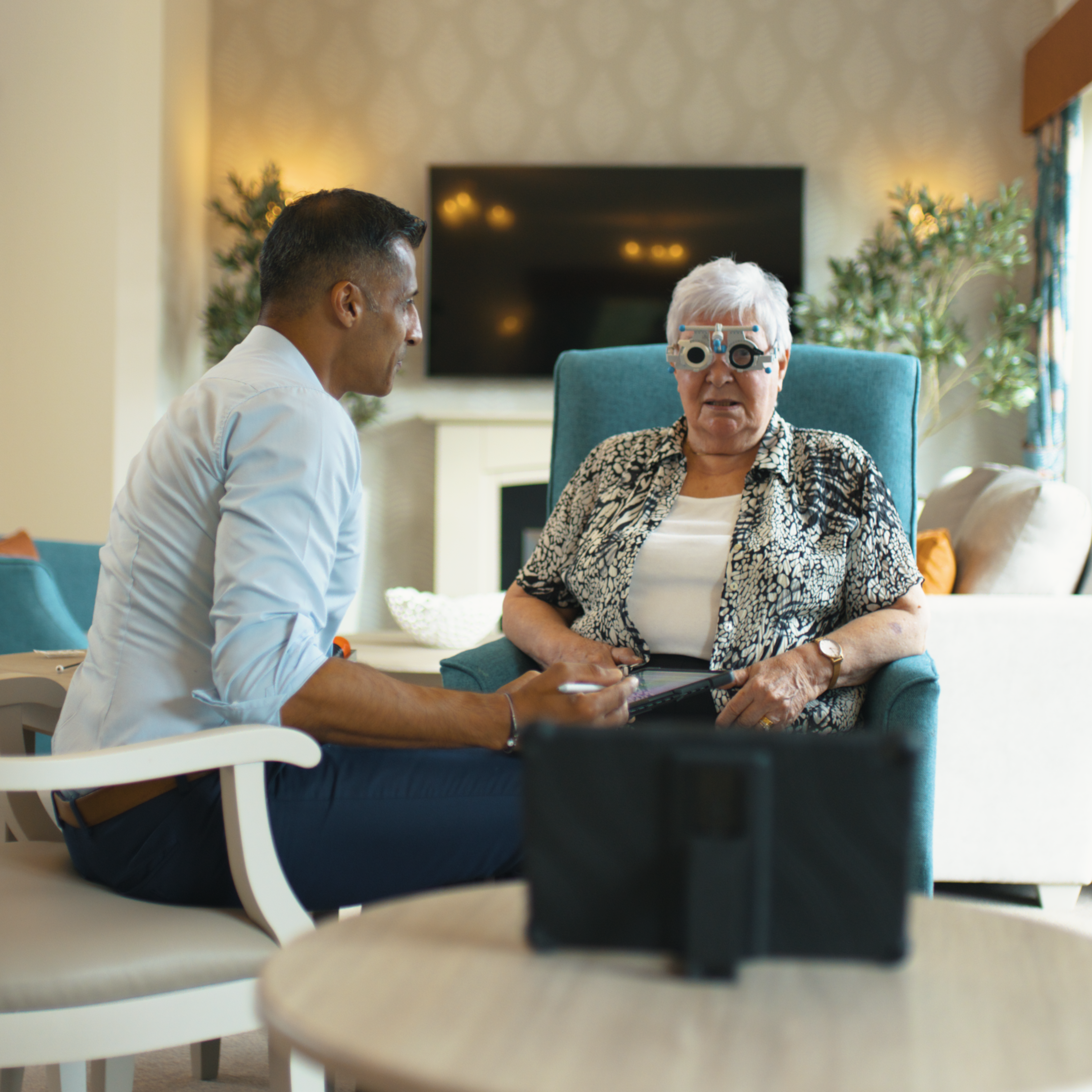 A woman having an eye test at home.